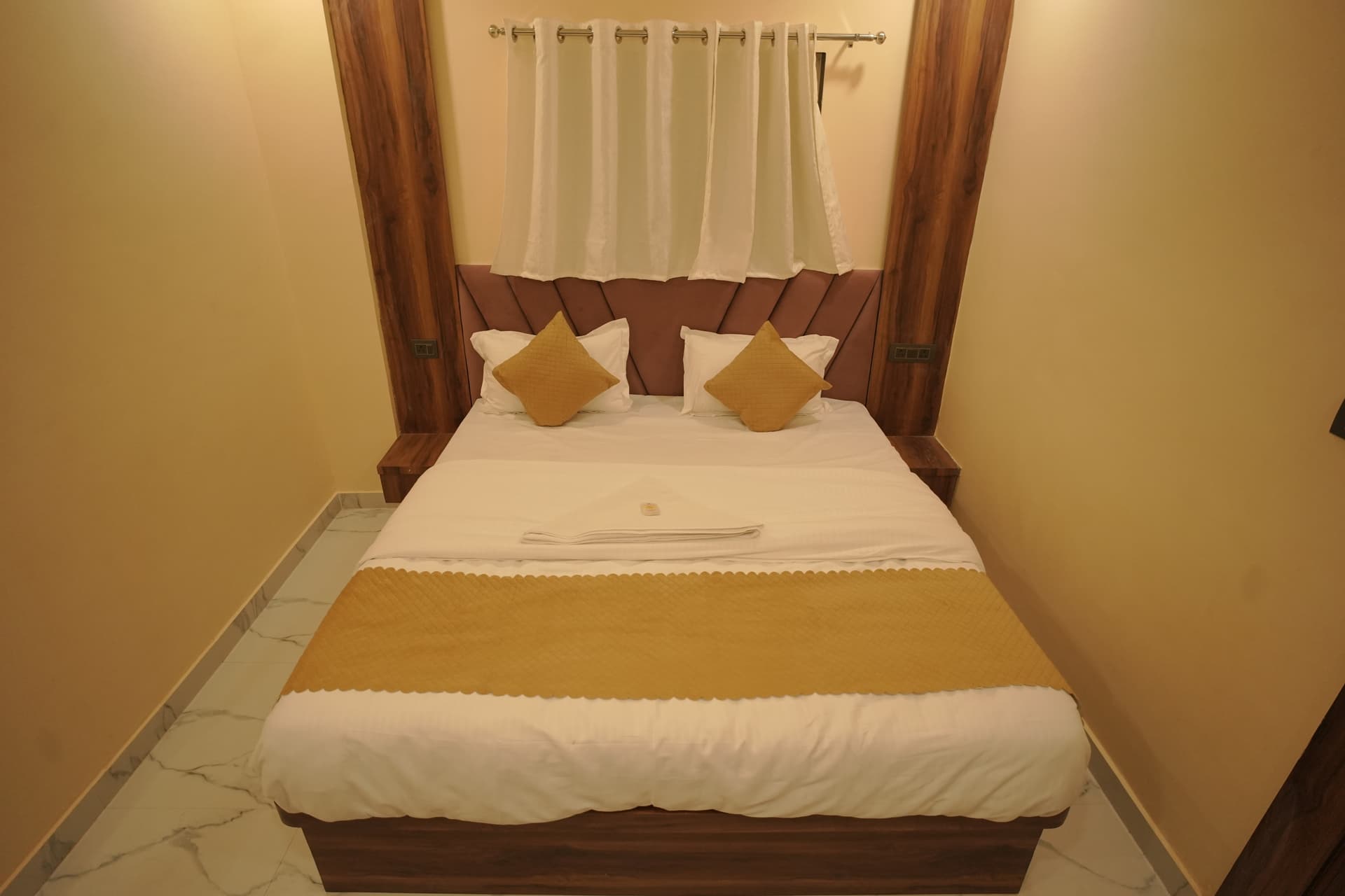 Hotel room with clean linen and AC
