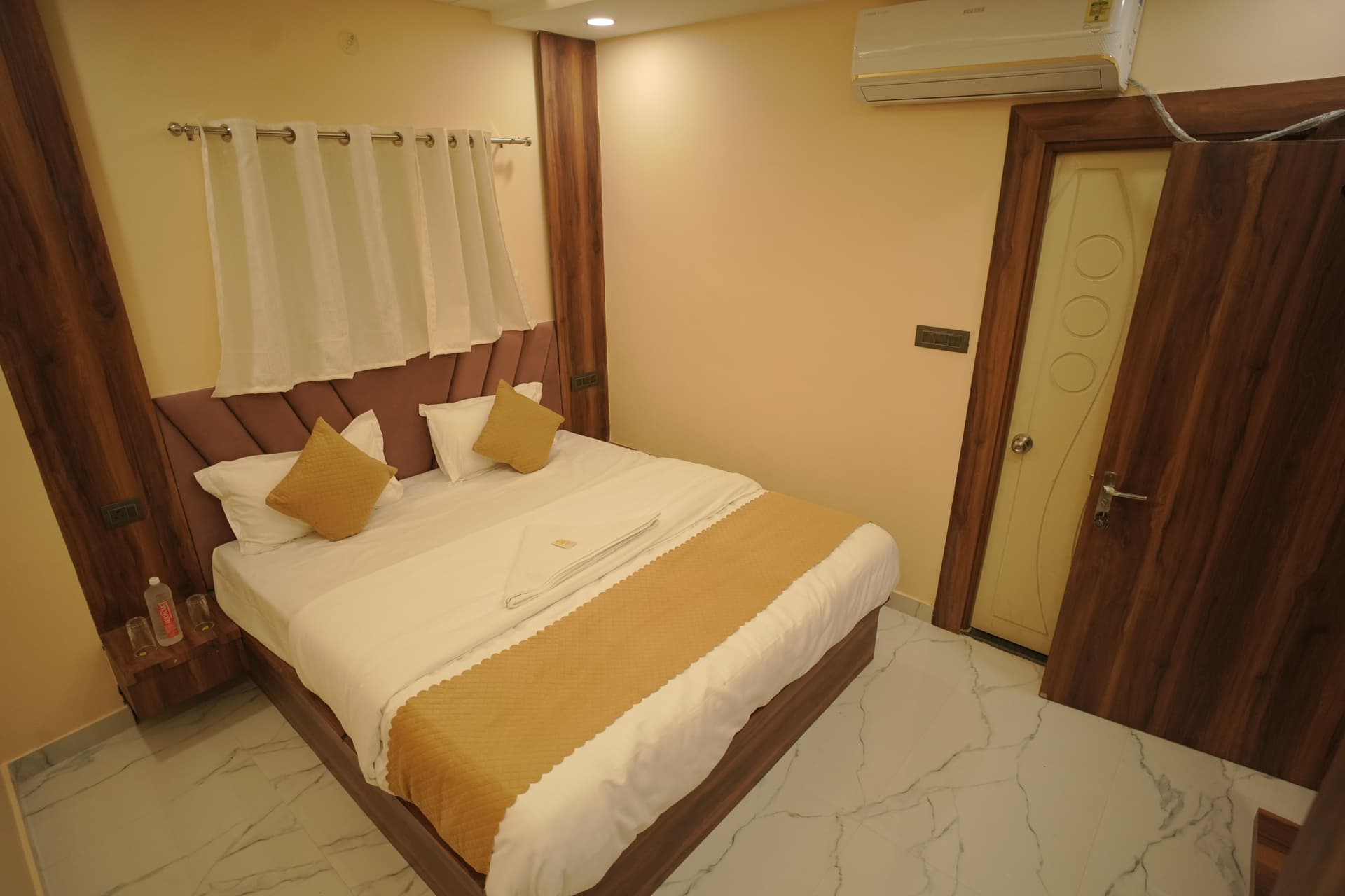 Hotel room with wardrobe and desk