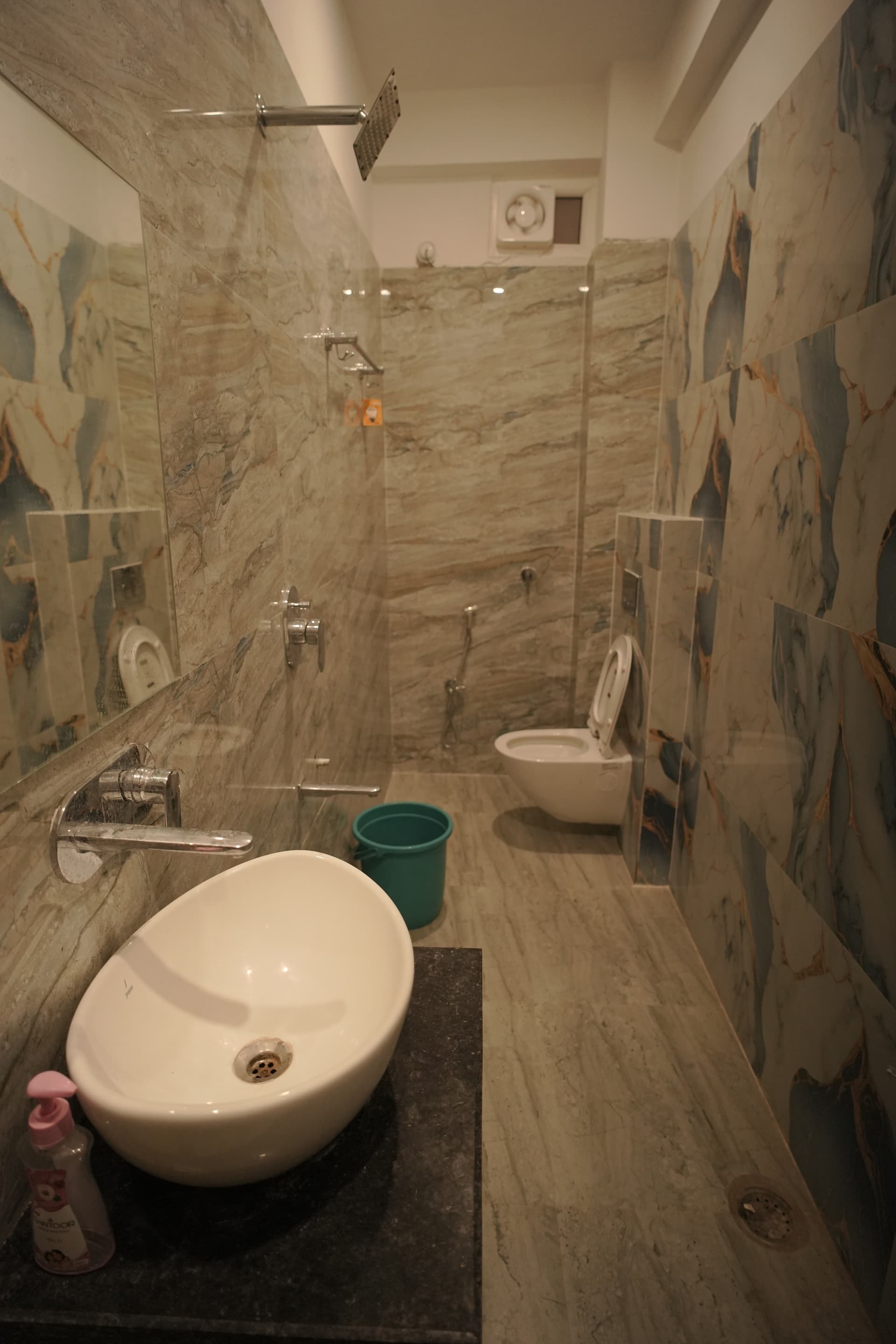 Clean attached washroom with modern fixtures